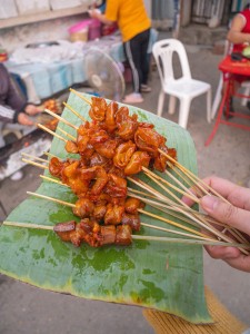 Beef tendon grilled in front of Chao Anouvong Stadium